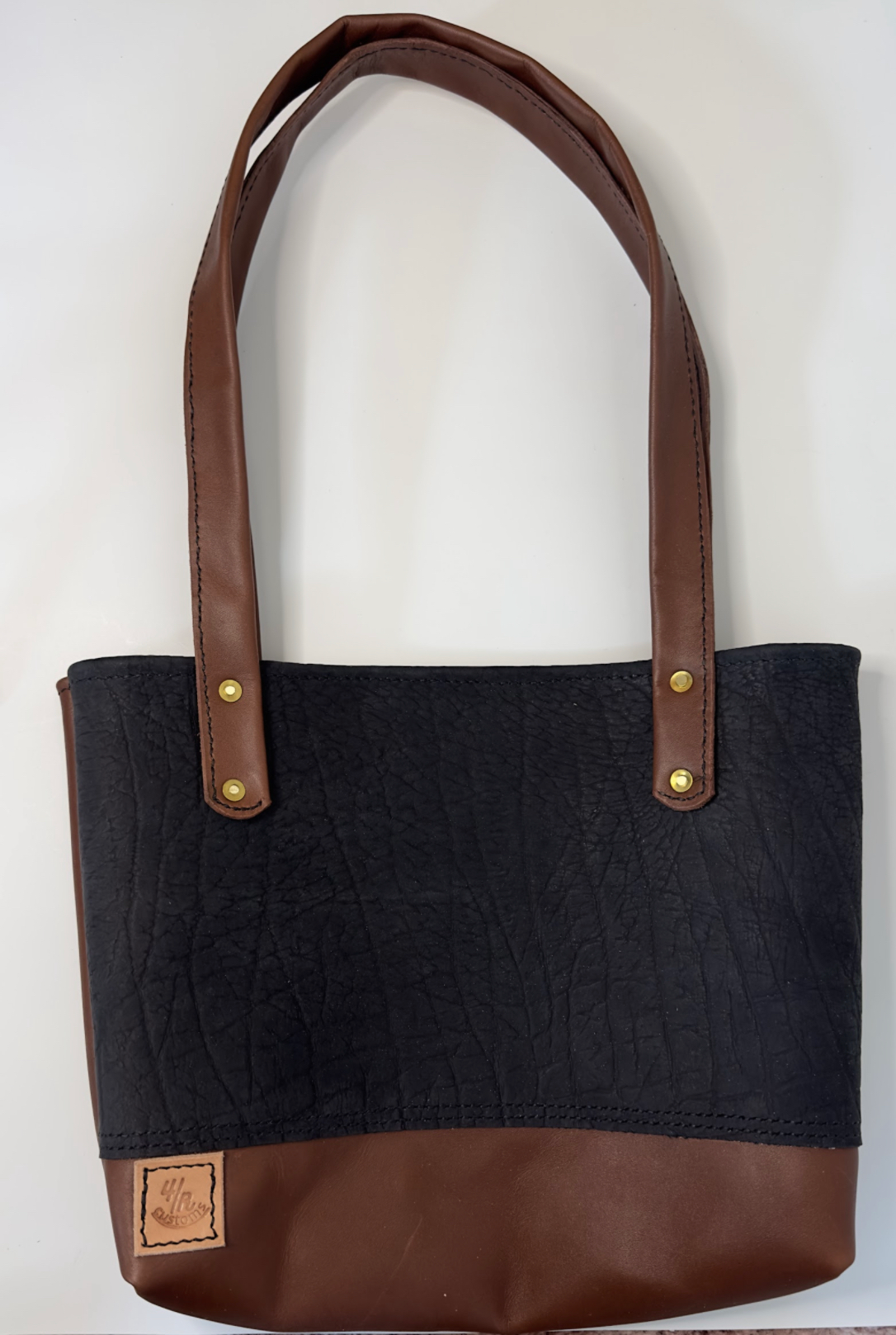 Woman’s wild boar leather bag.